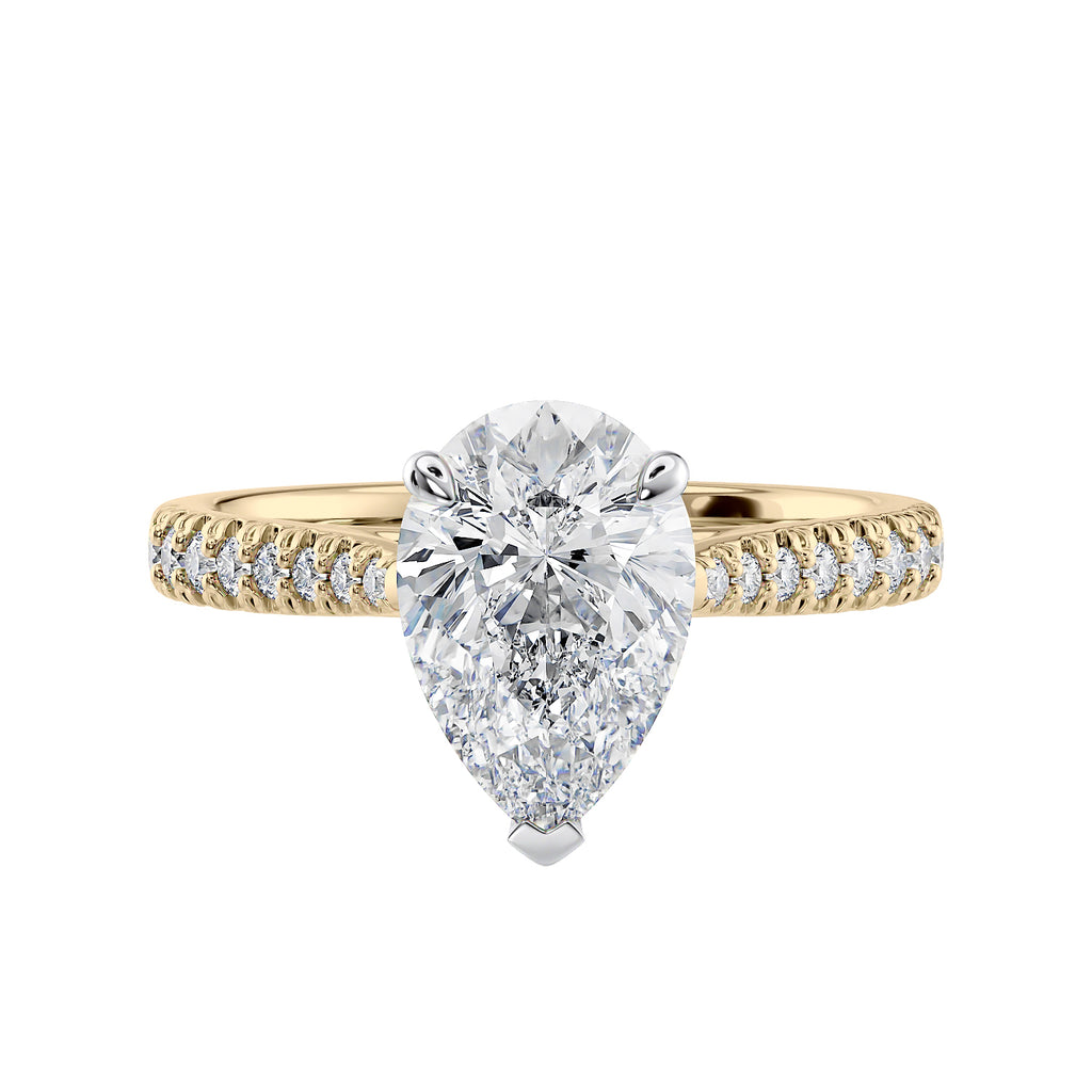 Pear cut lab grown diamond engagement ring with tapered diamond band gold front view.