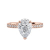 Pear cut lab grown diamond engagement ring with tapered diamond band rose gold front view.