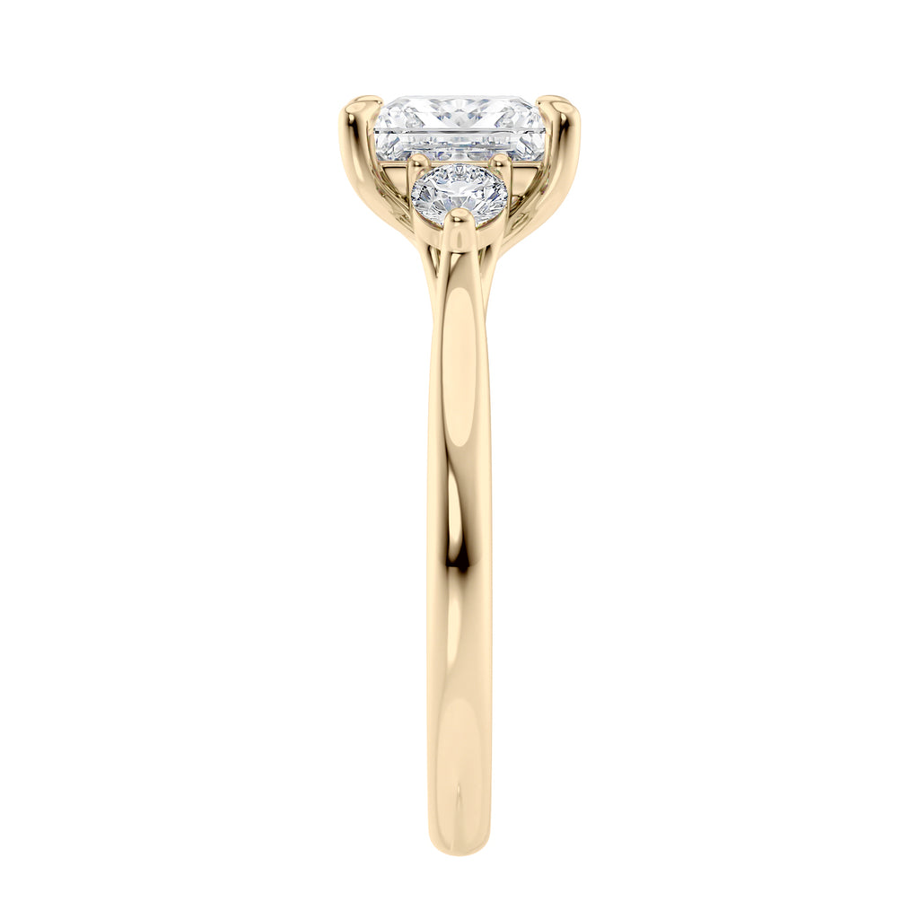 Lab grown square diamond 3 stone engagement ring in gold setting end view.