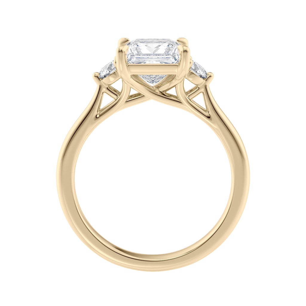 Lab grown square diamond 3 stone engagement ring in gold setting side view.