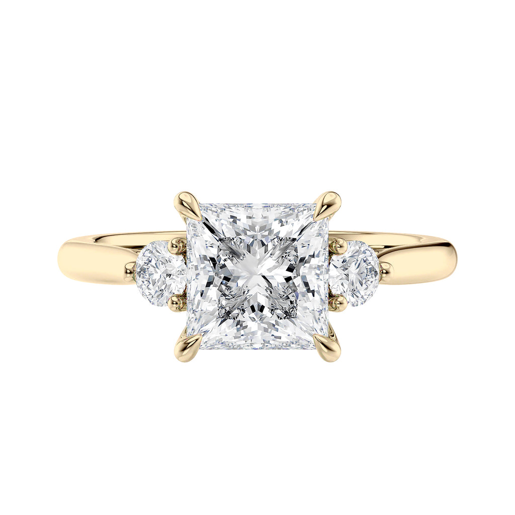 Lab grown square diamond 3 stone engagement ring in gold setting front view.