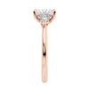Lab grown square diamond 3 stone engagement ring in rose gold setting end view.