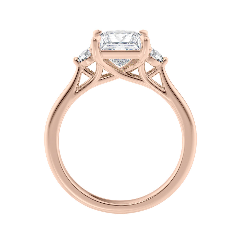 Lab grown square diamond 3 stone engagement ring in rose gold setting side view.