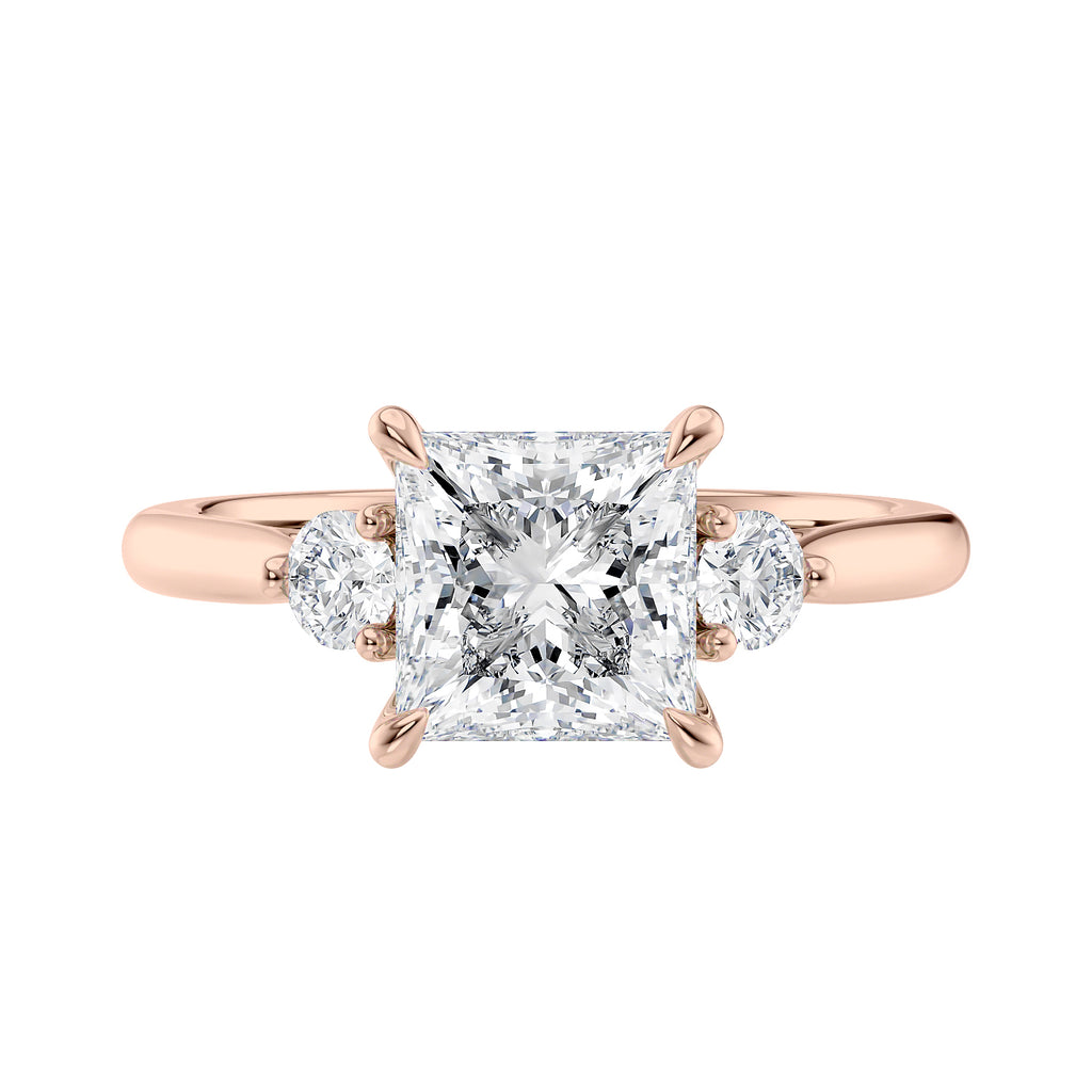 Lab grown square diamond 3 stone engagement ring in rose gold setting front view.