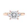 Lab grown square diamond 3 stone engagement ring in rose gold setting front view.