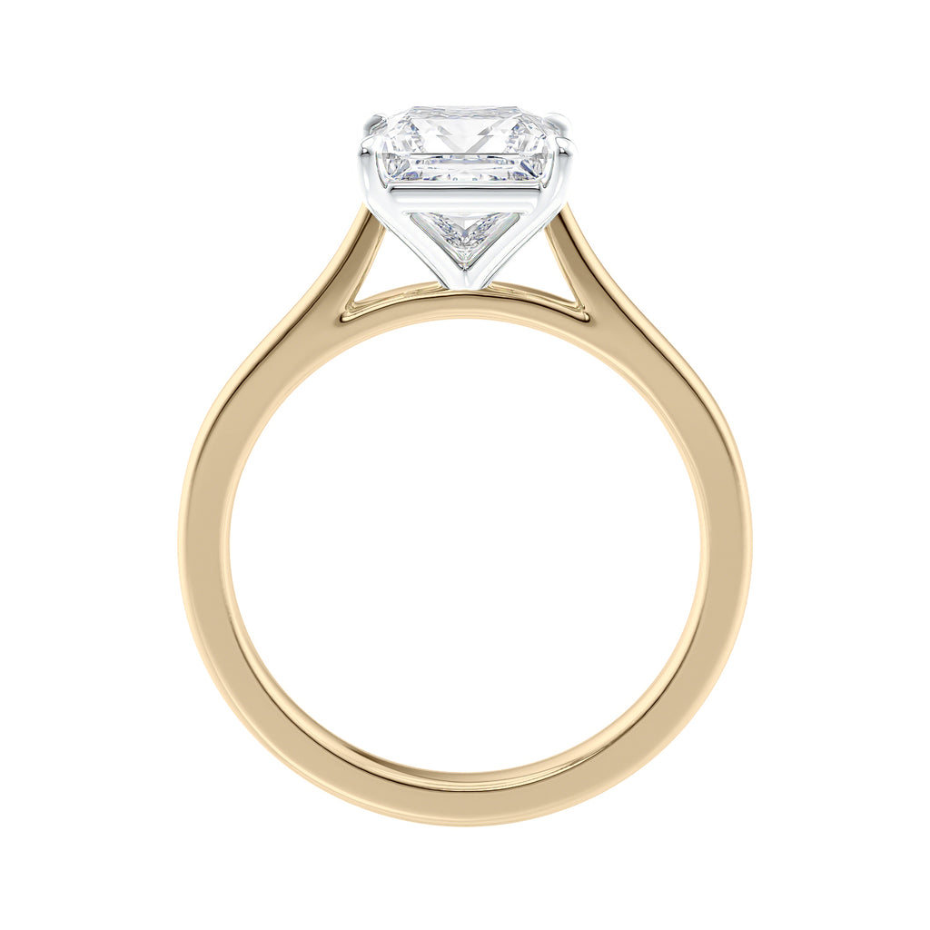 Princess cut solitaire diamond engagement ring with gold band side view.