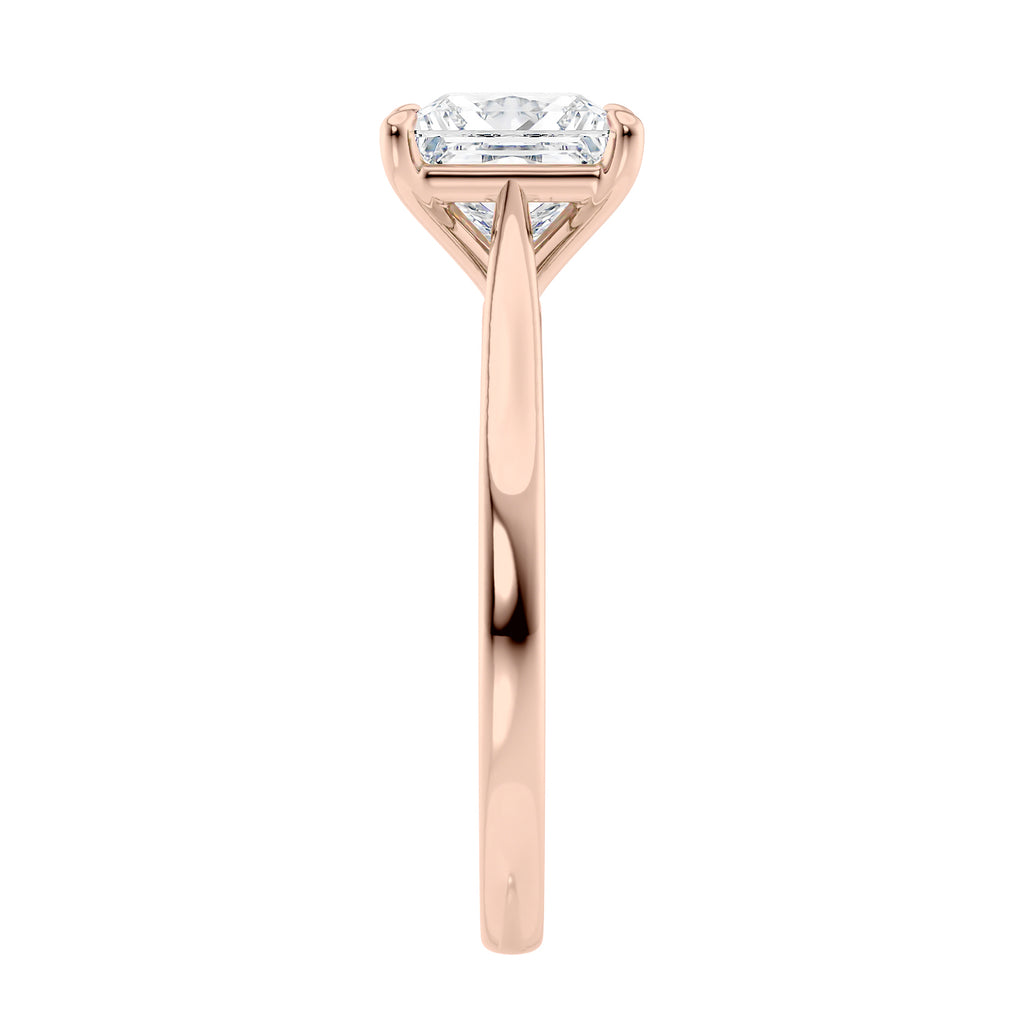 Princess cut solitaire diamond engagement ring with rose gold band end view.