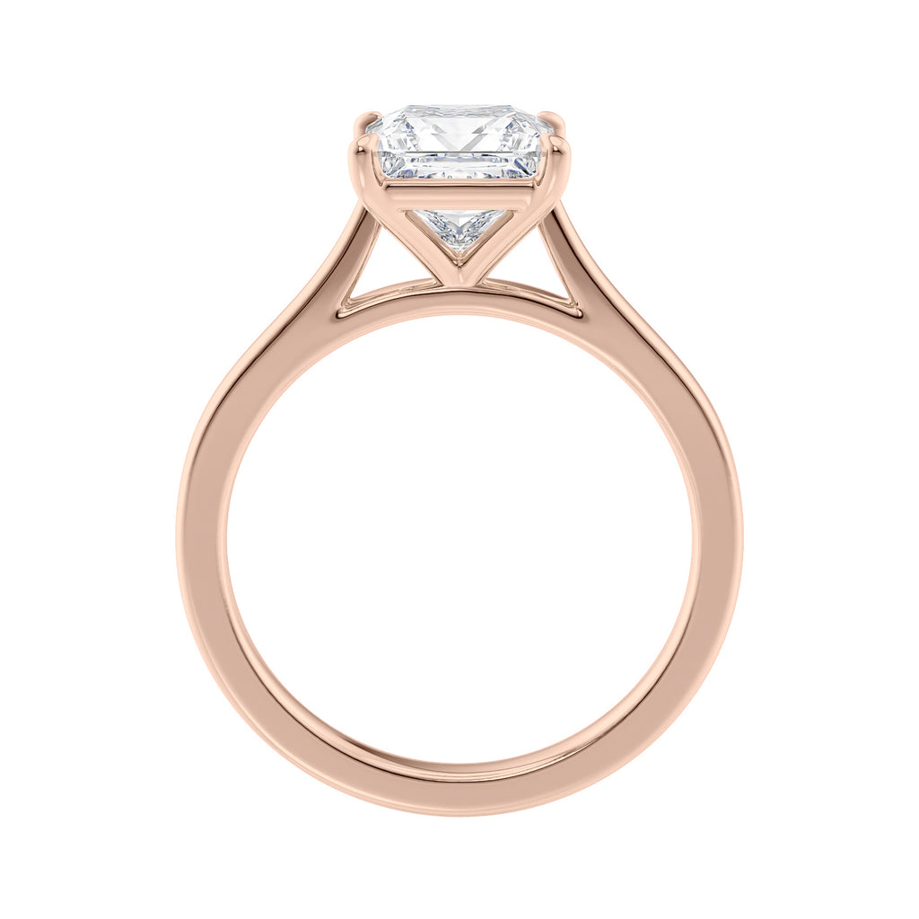 Princess cut solitaire diamond engagement ring with rose gold band side view.