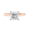 Princess cut solitaire diamond engagement ring with rose gold band front view.