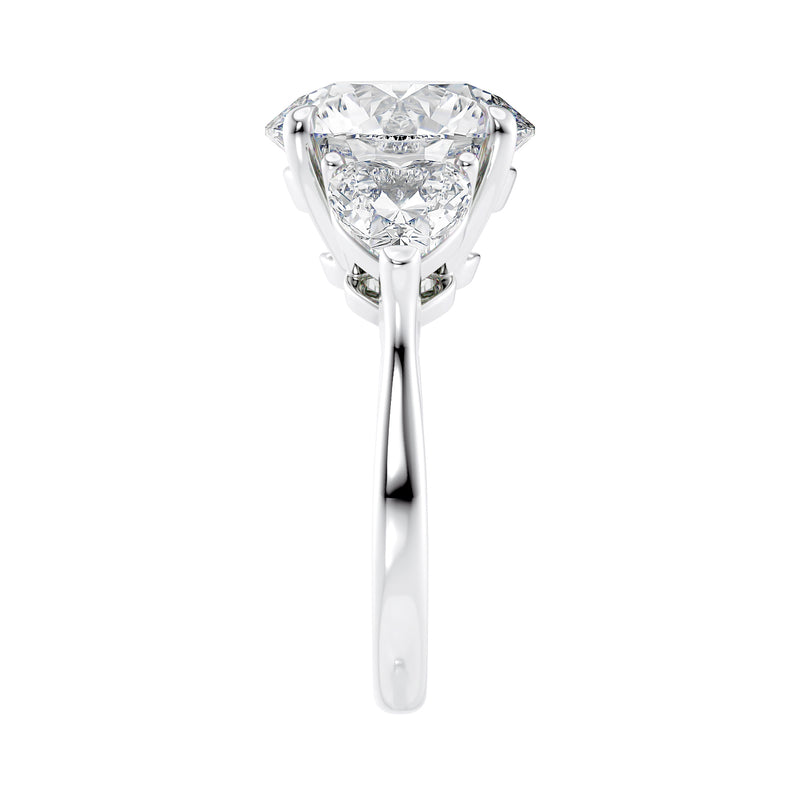 Round centre lab grown diamond 3 stone heart shape side stones white gold end view.