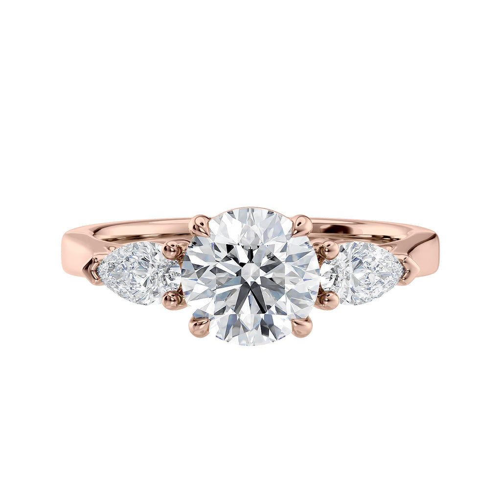 Rose gold round and pear three stone natural diamond engagement ring front view.
