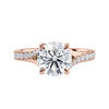 Brilliant cut diamond engagement ring with diamond set twist style band rose gold front view.