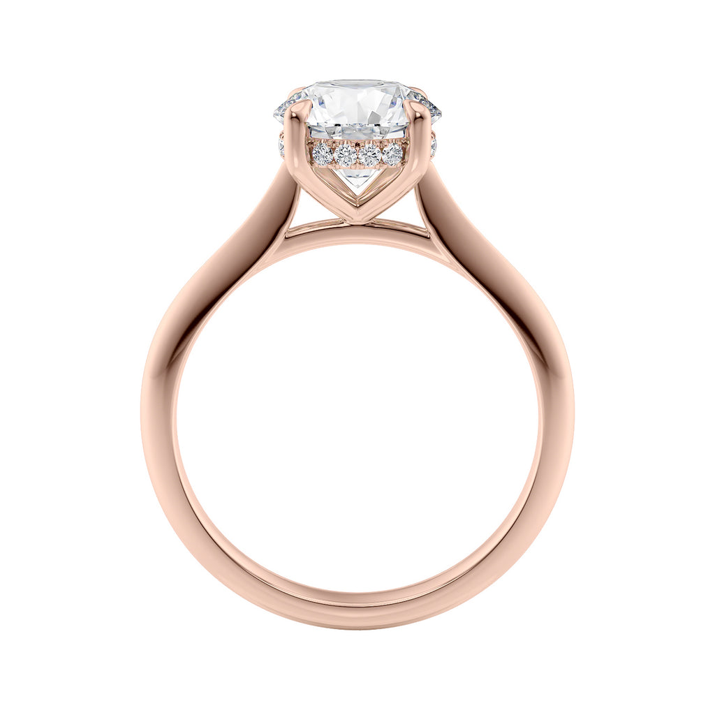 Two carat lab grown diamond solitaire with hidden halo rose gold band side view.