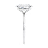 Laboratory grown oval diamond engagement ring slim band end view.