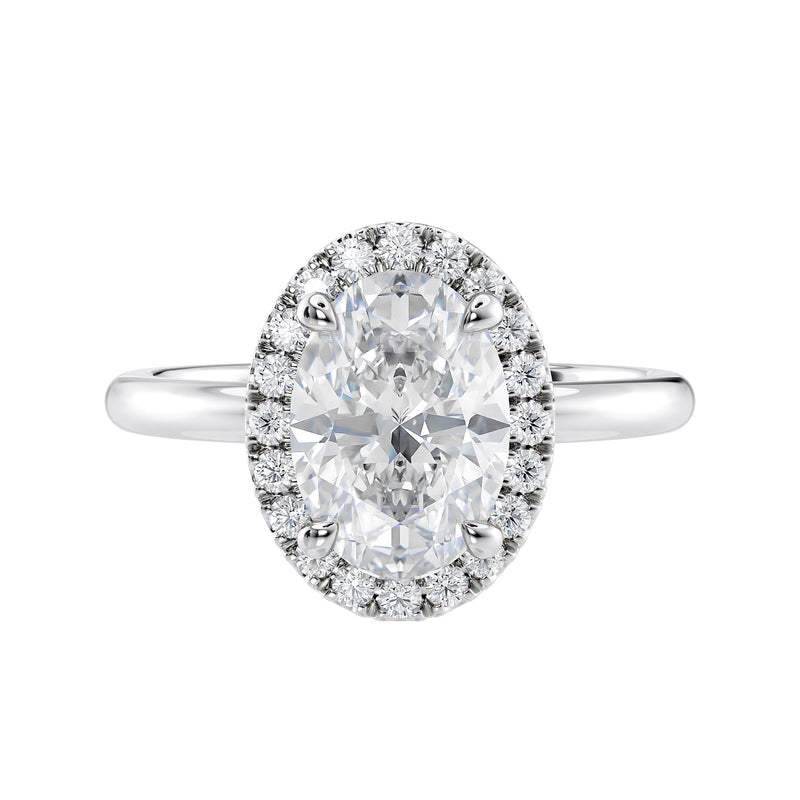 Oval halo diamond engagement ring in white gold front view.