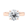 Laboratory grown round diamond solitaire engagement ring with wide rose gold band front view.