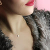 Gold star necklace by Eric McGuire